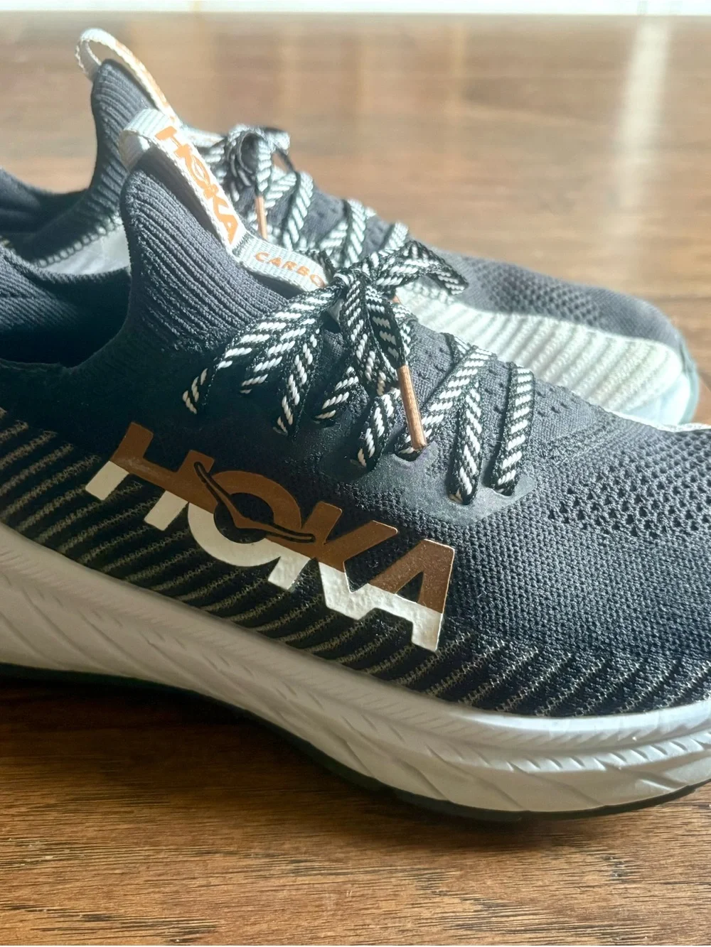 Hoka Black Knit Running Shoes with White Midsole and Tan Logo - Picture 1 of 4